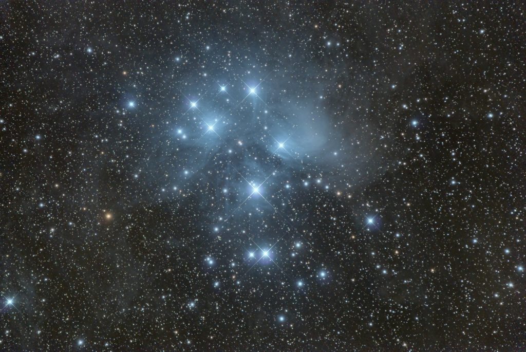a cluster of stars in the sky